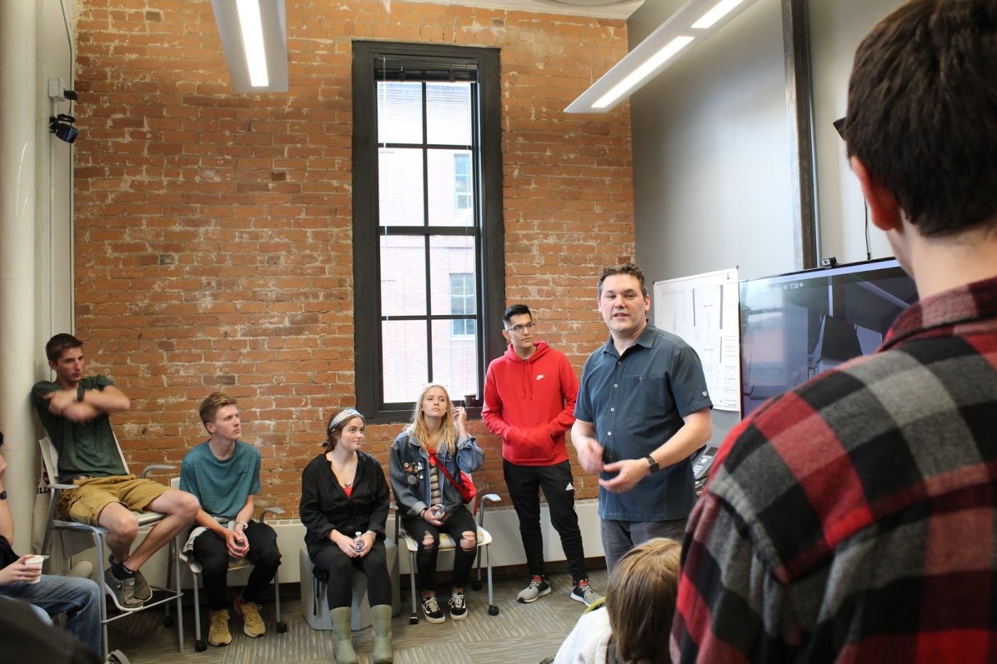 Stine presenting to visiting NDSU architecture students at LHB